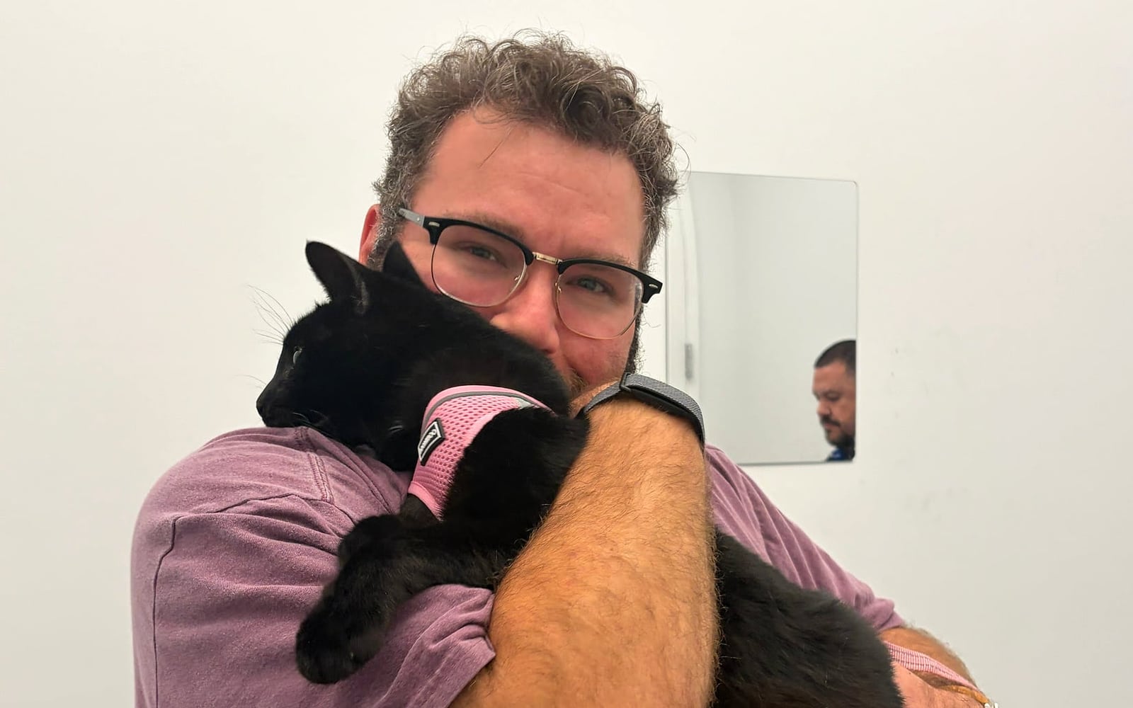 Gabe holding Marvin before their flight from San Francisco to Michigan