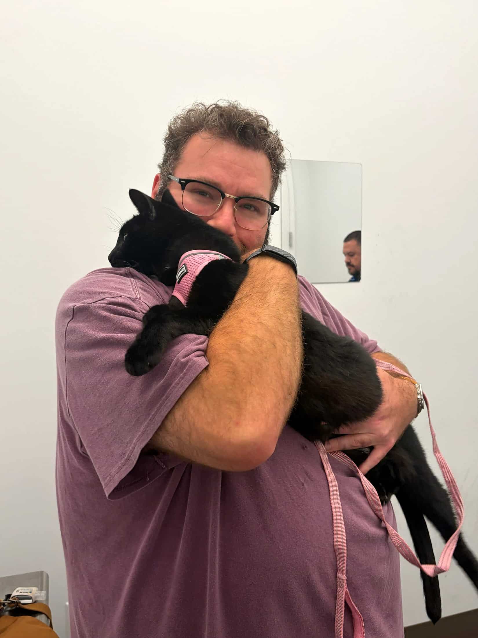Gabe from Cabin Companions holding Marvin before their flight from San Francisco