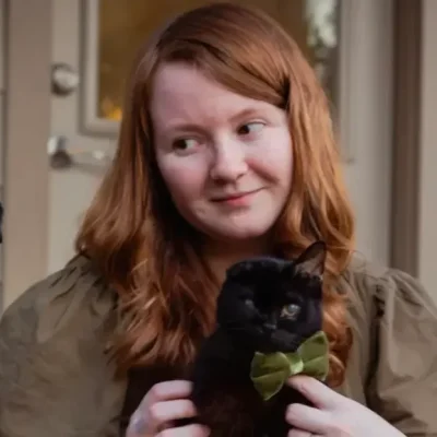 Natascha Hamman, veterinary technician, holding a cat